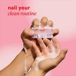 Hands using a soapy nail brush with header text “nail your clean routine.”