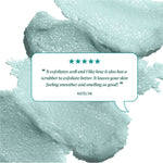 Background texture of teal foaming body scrub behind a review bubble. Text shows five teal stars and reads: ‘It exfoliates well and I like how it also has a scrubber to exfoliate better. It leaves your skin feeling smoother and smelling so good!’ 