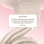  The box shows five stars and the quote: ‘The flower‑shaped tip applies both formulas like cake icing. It smells amazing and leaves my skin soft, smooth, & moisturized.’ The reviewer name ‘Moon Child’ appears below.