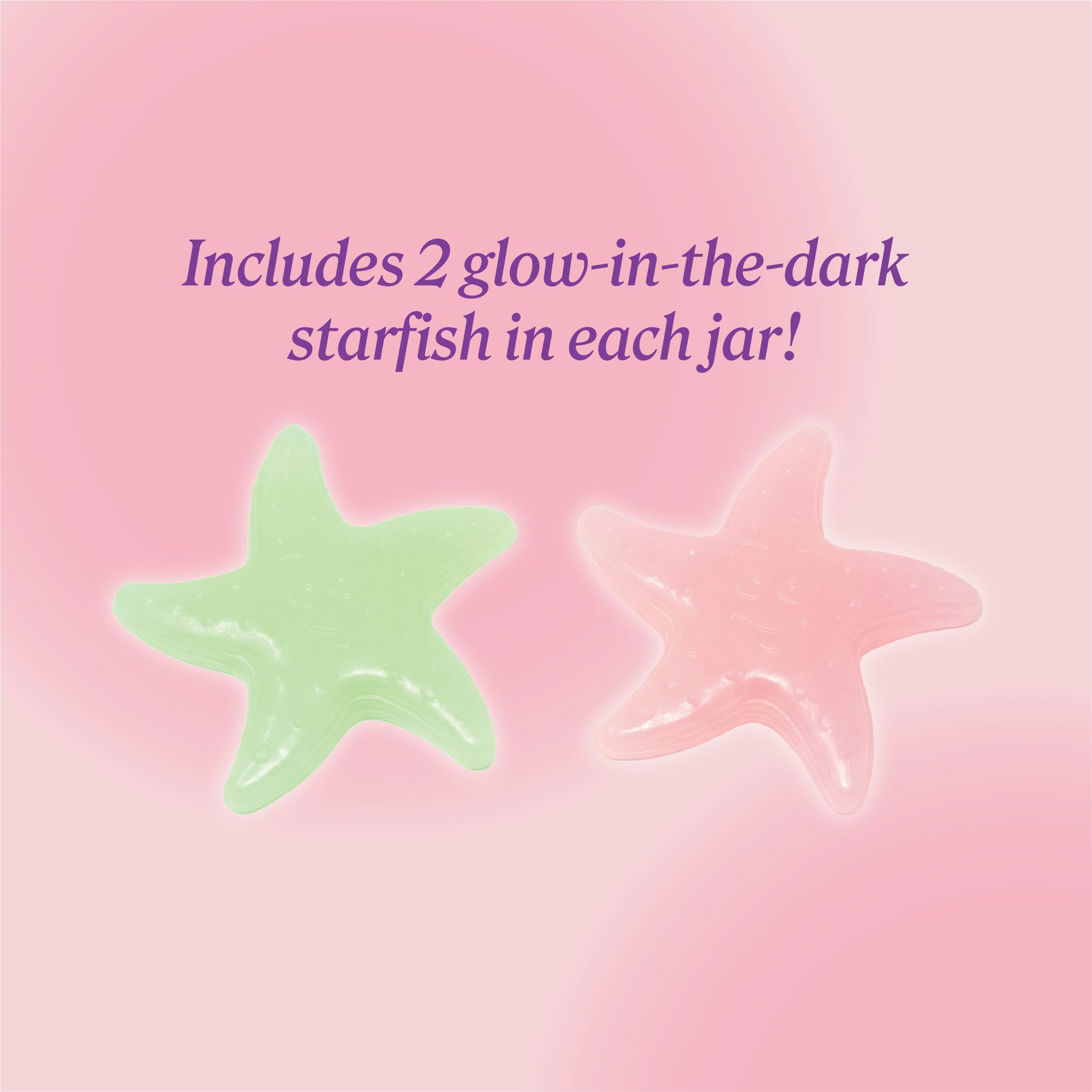 Two glow‑in‑the‑dark starfish—one green and one pink—displayed on a soft pink background with text reading ‘Includes 2 glow‑in‑the‑dark starfish in each jar.'